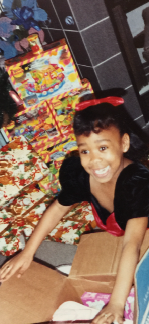 Young Keisha Clay opening gifts on Christmas