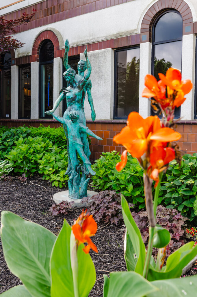 an artistic shot of a copper statue outside the museum