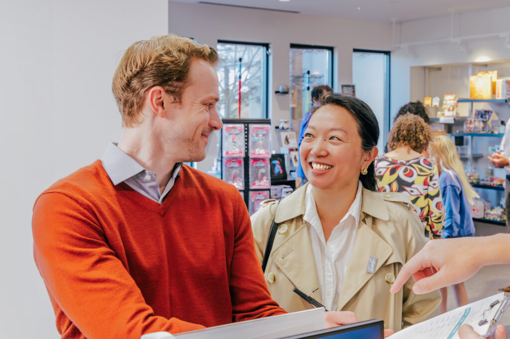 a couple smiles at each other