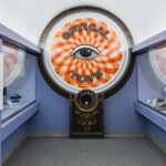 a wide view of the optical toys exhibit sign