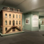9ft tall beige dollhouse in the Doll Gallery.