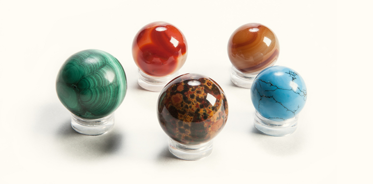 Five differently colored Agate marbles