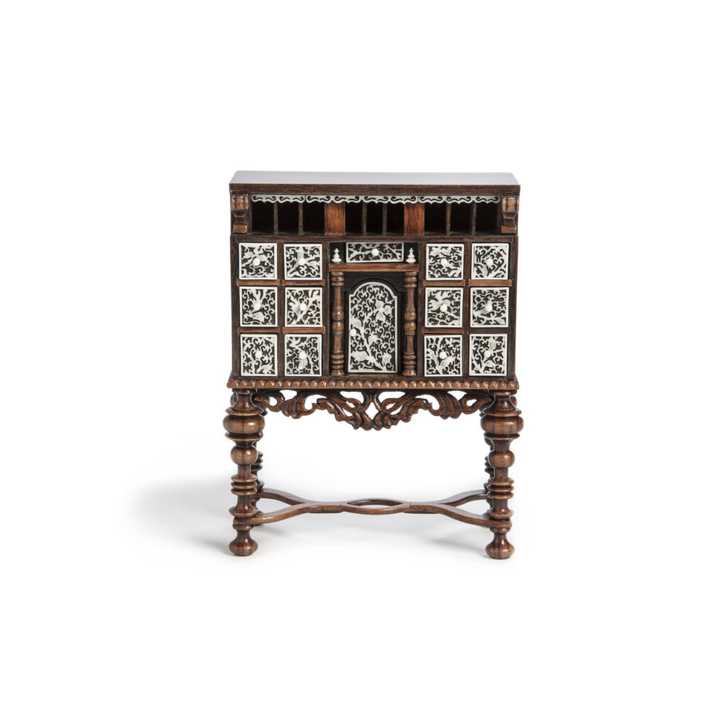 Ornate fine-scale miniature chest with carvings on the front.