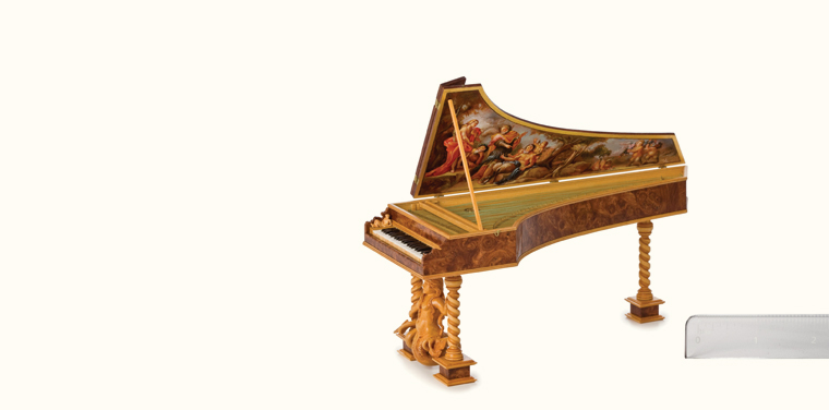 Fine-scale miniature harpsichord with a painting underneath the lid.