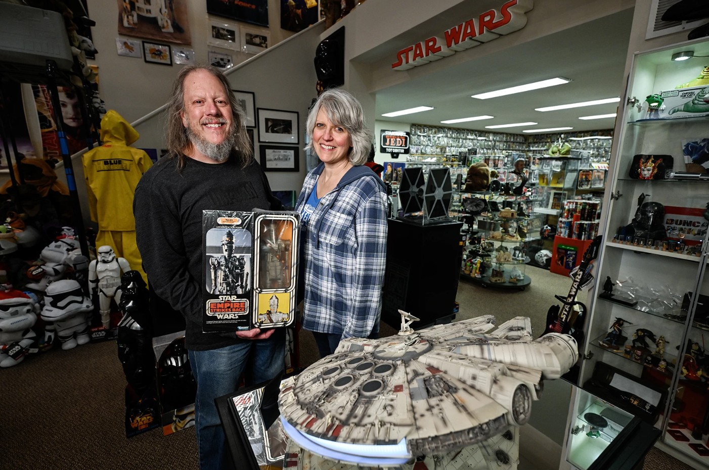 Duncan Jenkins and his wife with their Star Wars collection.