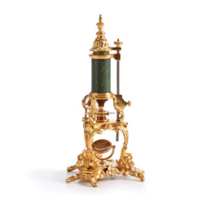 Green and gold Louis the XV microscope in miniature scale.