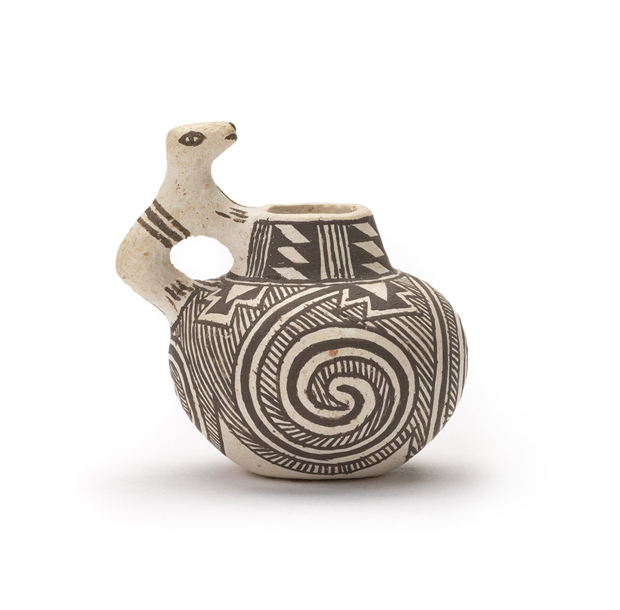 Miniature Anasazi vessel with an animal effegy handle.