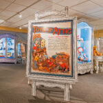 Toys from the Attic exhibition signage featuring children playing with toys.
