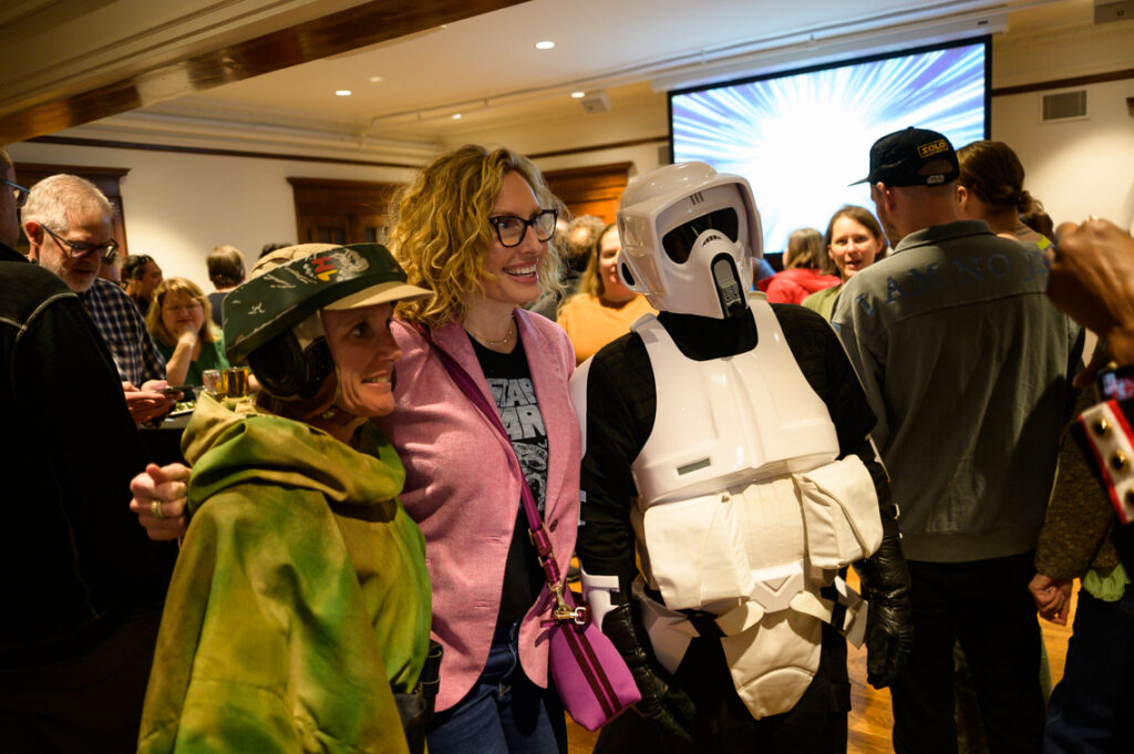 Woman at the opening reception for a Star Wars exhibition.