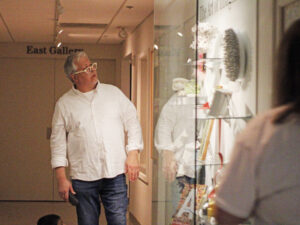 Artist Stephen T. Johnson looking at the Art of the Imagination case.