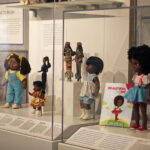 Cases featuring Black dolls and toys.