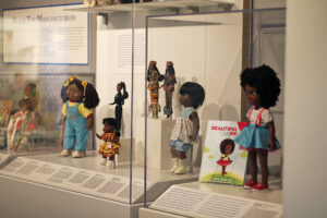 Cases featuring Black dolls and toys.