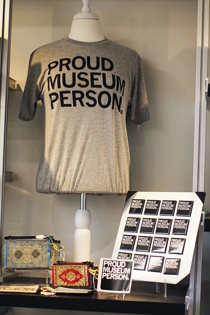 "Proud Museum Person" t-shir and magnets displayed in the Museum Store.