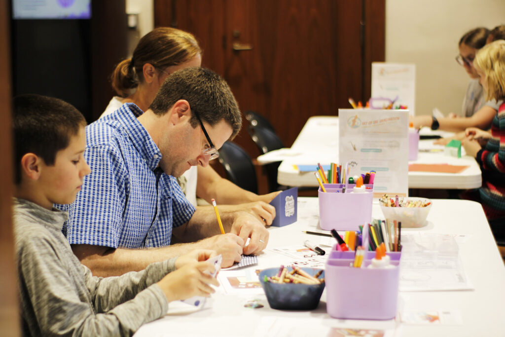 Family doing a drop-in craft together.