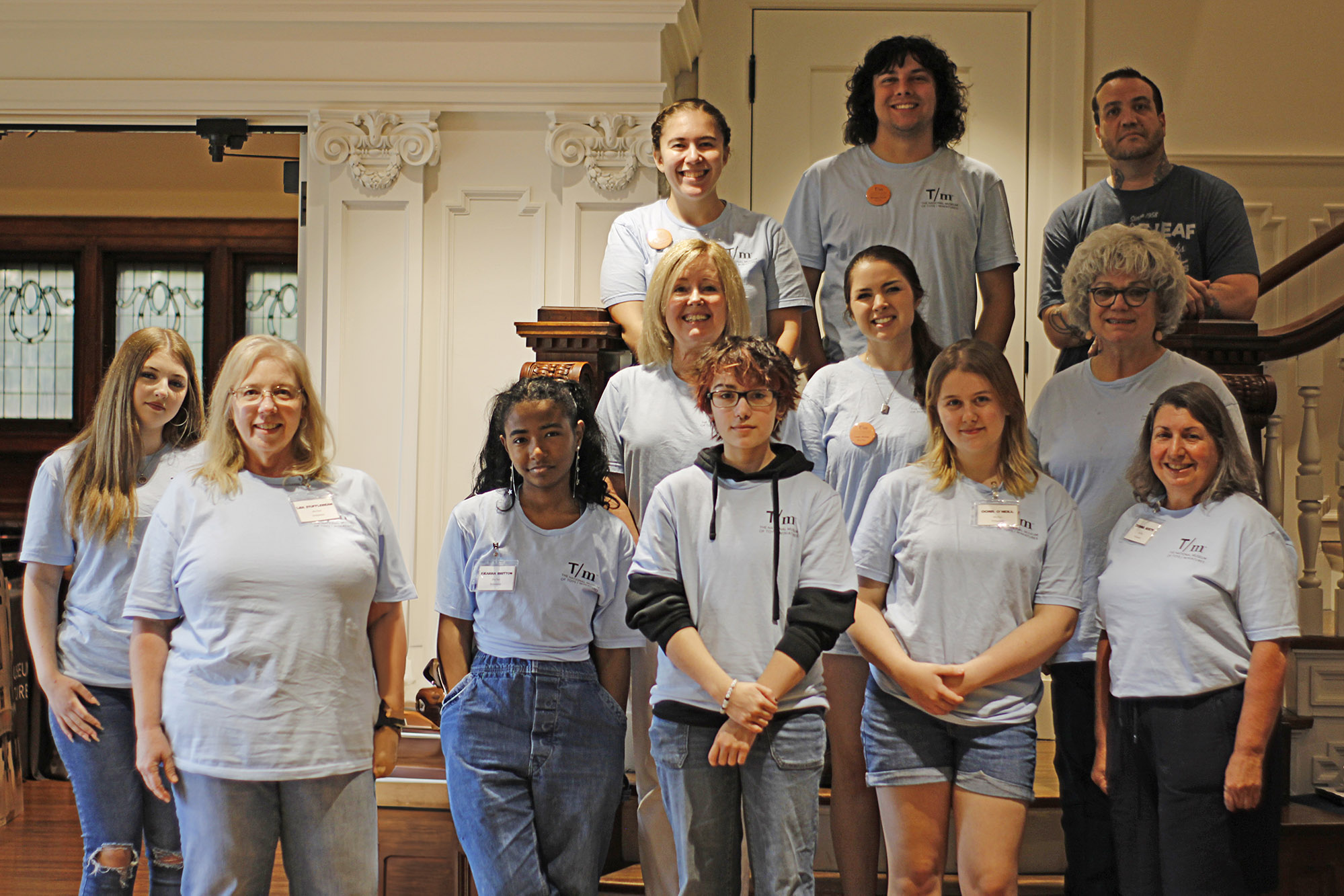 Museum staff and volunteers posing for a group photo before Summer Camp.