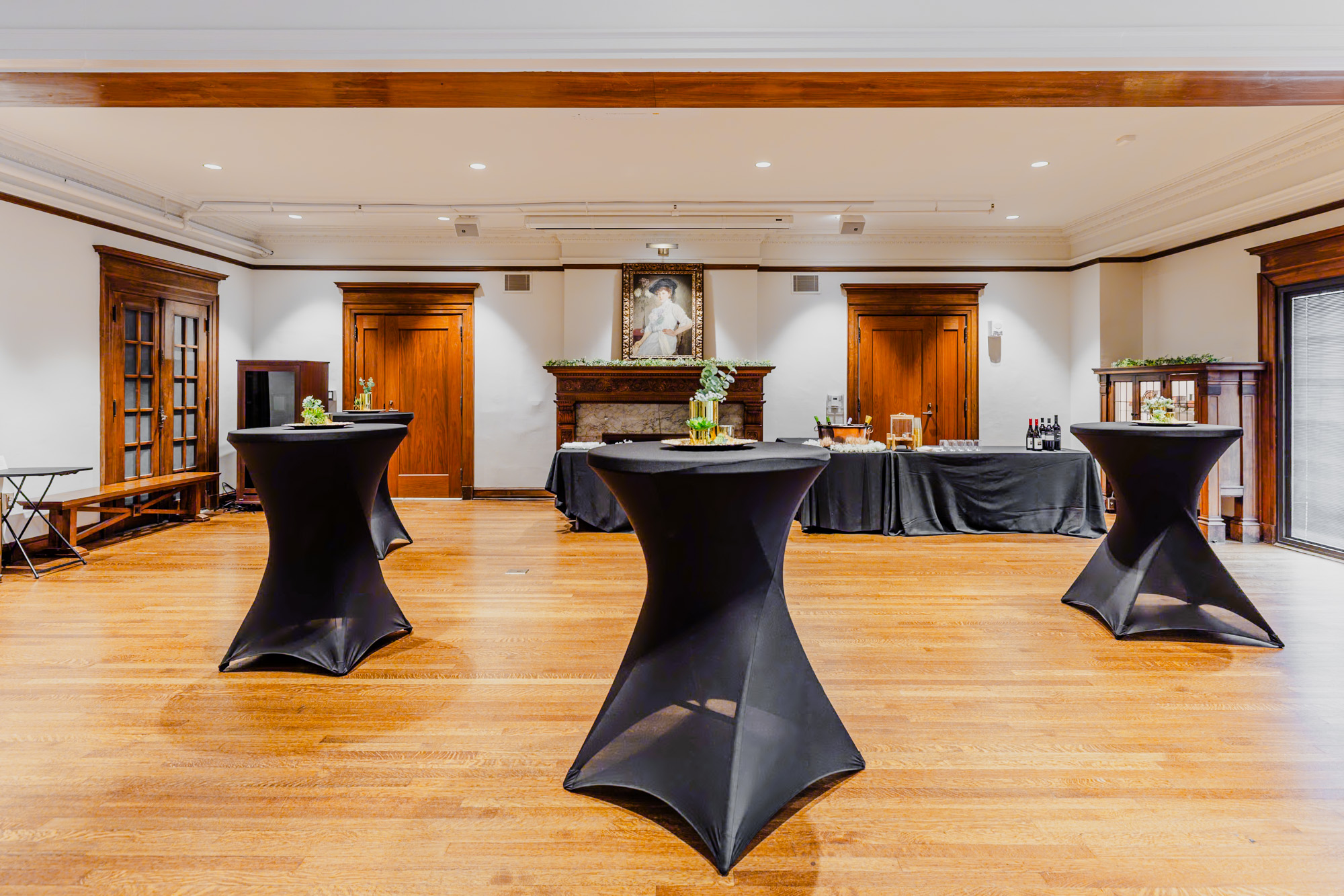 Cocktail tables decorated in the Tureman Mansion event space.