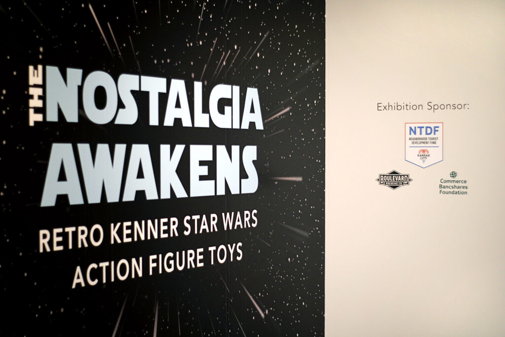 Exhibition sponsors on a wall for "The Nostalgia Awakens" exhibition.